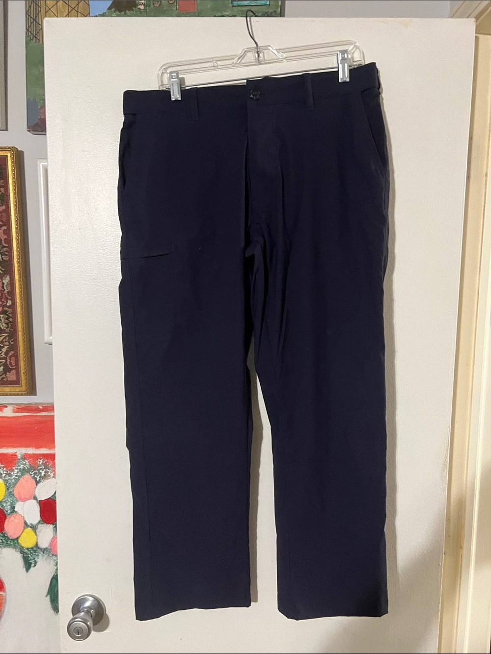 UB tech classic fit flat front pants.